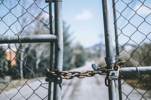 A gate locked with a padlock